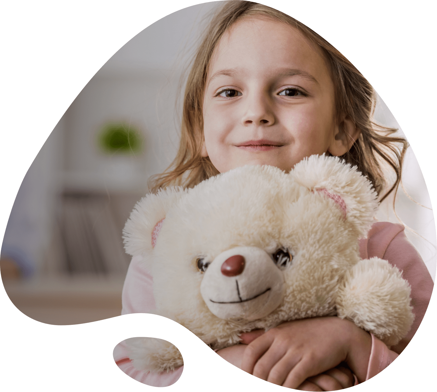Happy child with a teddy bear